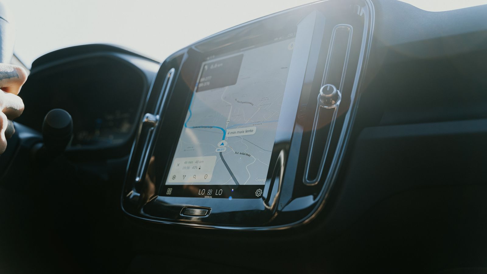 Car dashboard touchscreen showing a map